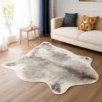 Decor with cow skin rug and faux animal skin rugs